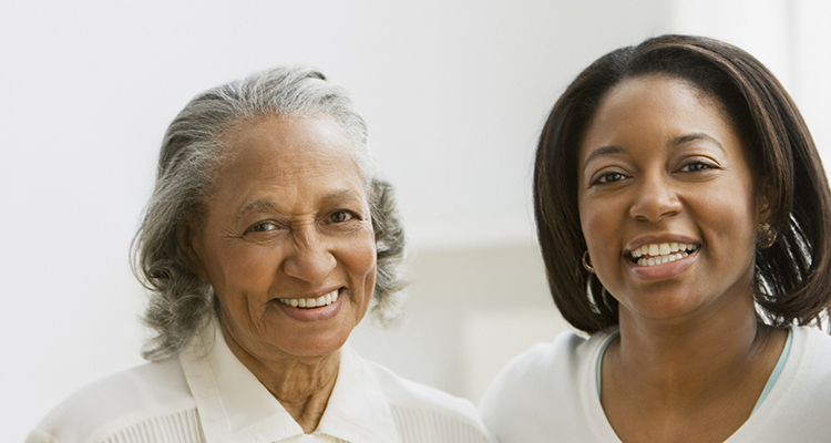 elderly woman smiling with her companion